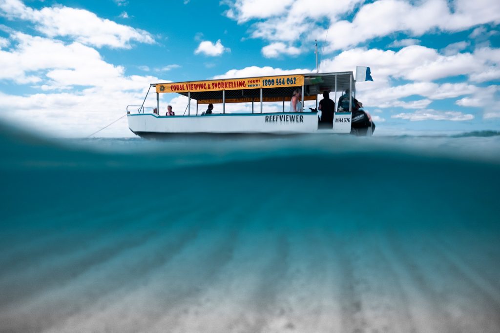 Experience the incredible World Heritage-listed Ningaloo Reef on a glass bottom boat tour. Photo credit: Tourism Western Australia.